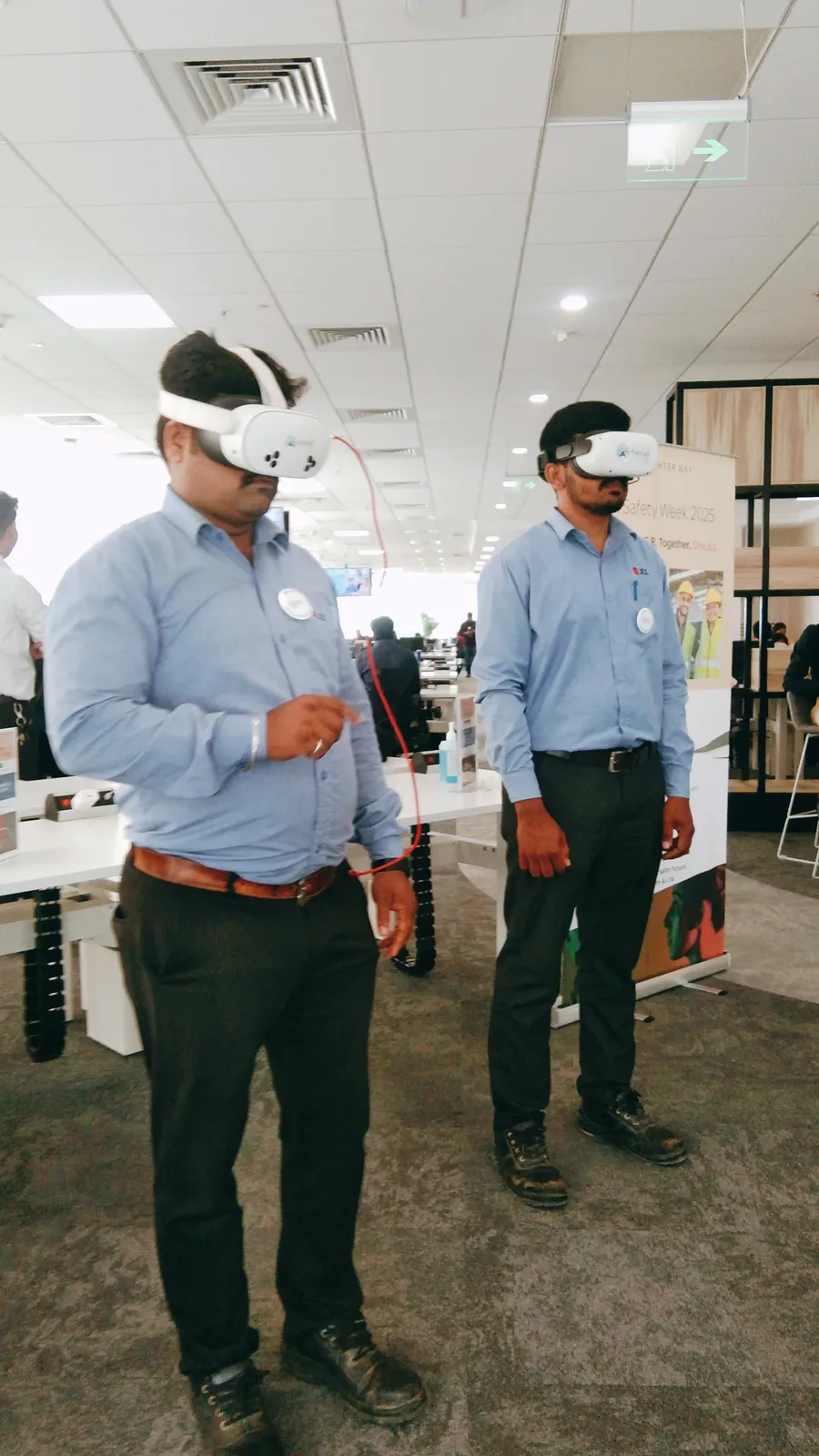 Two workers using Aatral VR headsets for Safetizen safety training during JLL Safety Week 2025